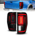 311447 by ANZO - Tail Light Assembly; LED; Smoke Lens; Black Housing; w/Light Bar; Pair;